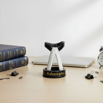 Lawyer Collar Pen Holder on Desk with Laptop and Books
